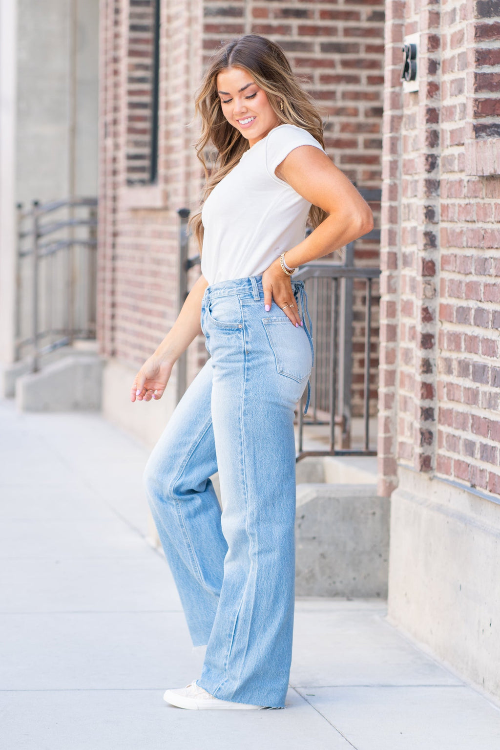 KanCan Jeans  KanCan Rigid Denim  Flare, 32" Inseam  High Rise, 12" Front Rise Light Blue Wash  100% Cotton Fly: Exposed Button Style #: KC8725L Contact us for any additional measurements or sizing.  *Measured on the smallest size, measurements may vary by size.  Jacquelyn wears a size 25 in jeans, a small in tops, and 6.5 in shoes. She is wearing a size 25 in these jeans.