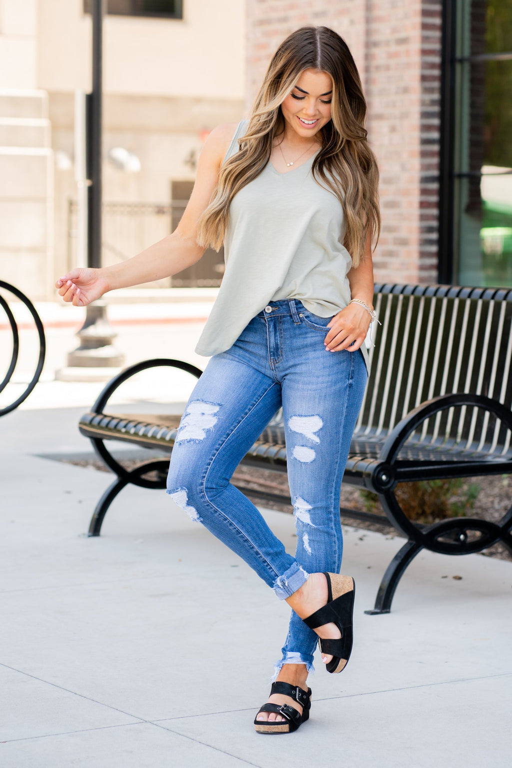 KanCan Jeans Collection: Core Collection Color: Medium Wash, 99% COTTON 1% SPANDEX Cut: Skinny, 29" Inseam* Rise: Mid-Rise, 8.5" Front Rise* Machine Wash Separately In Cold Water Stitching: Classic Fly: Zipper Style #: KC7103M Contact us for any additional measurements or sizing.  *Measured on the smallest size, measurements may vary by size.    Jacquelyn wears a size 25 in jeans, a small in tops, and 6.5 in shoes. She is wearing size 25 in these jeans.