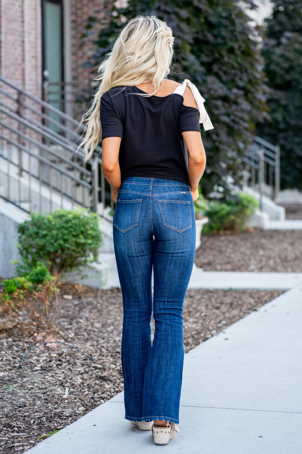 KanCan Jeans Collection: Core Style    Color: Dark Wash Cut: Flare, 33.75" Inseam* Rise: Mid-Rise, 9" Front Rise* 54% 54% COTTON 34% Rayon 10% POLYESTER 2% SPANDEX Fly: Zipper Style #: KC6102LOH Contact us for any additional measurements or sizing.    *Measured on the smallest size, measurements may vary by size.      Cas is 5'7" and wears a size 25 in jeans, a small in tops, and 8 in shoes. She is wearing size 25 in these jeans. 