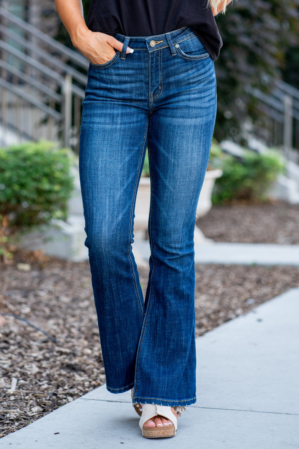 KanCan Jeans Collection: Core Style    Color: Dark Wash Cut: Flare, 33.75" Inseam* Rise: Mid-Rise, 9" Front Rise* 54% 54% COTTON 34% Rayon 10% POLYESTER 2% SPANDEX Fly: Zipper Style #: KC6102LOH Contact us for any additional measurements or sizing.    *Measured on the smallest size, measurements may vary by size.      Cas is 5'7" and wears a size 25 in jeans, a small in tops, and 8 in shoes. She is wearing size 25 in these jeans. 