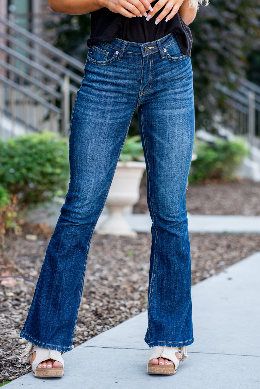 KanCan Jeans Collection: Core Style    Color: Dark Wash Cut: Flare, 33.75" Inseam* Rise: Mid-Rise, 9" Front Rise* 54% 54% COTTON 34% Rayon 10% POLYESTER 2% SPANDEX Fly: Zipper Style #: KC6102LOH Contact us for any additional measurements or sizing.    *Measured on the smallest size, measurements may vary by size.      Cas is 5'7" and wears a size 25 in jeans, a small in tops, and 8 in shoes. She is wearing size 25 in these jeans. 