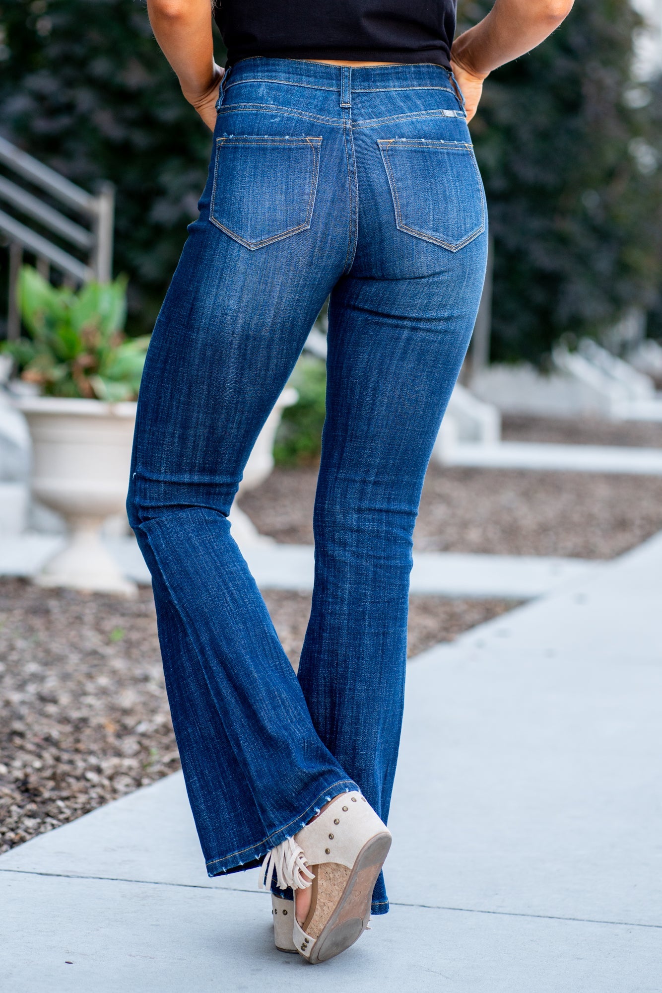 KanCan Jeans Collection: Core Style    Color: Dark Wash Cut: Flare, 33.75" Inseam* Rise: Mid-Rise, 9" Front Rise* 54% 54% COTTON 34% Rayon 10% POLYESTER 2% SPANDEX Fly: Zipper Style #: KC6102LOH Contact us for any additional measurements or sizing.    *Measured on the smallest size, measurements may vary by size.      Cas is 5'7" and wears a size 25 in jeans, a small in tops, and 8 in shoes. She is wearing size 25 in these jeans. 