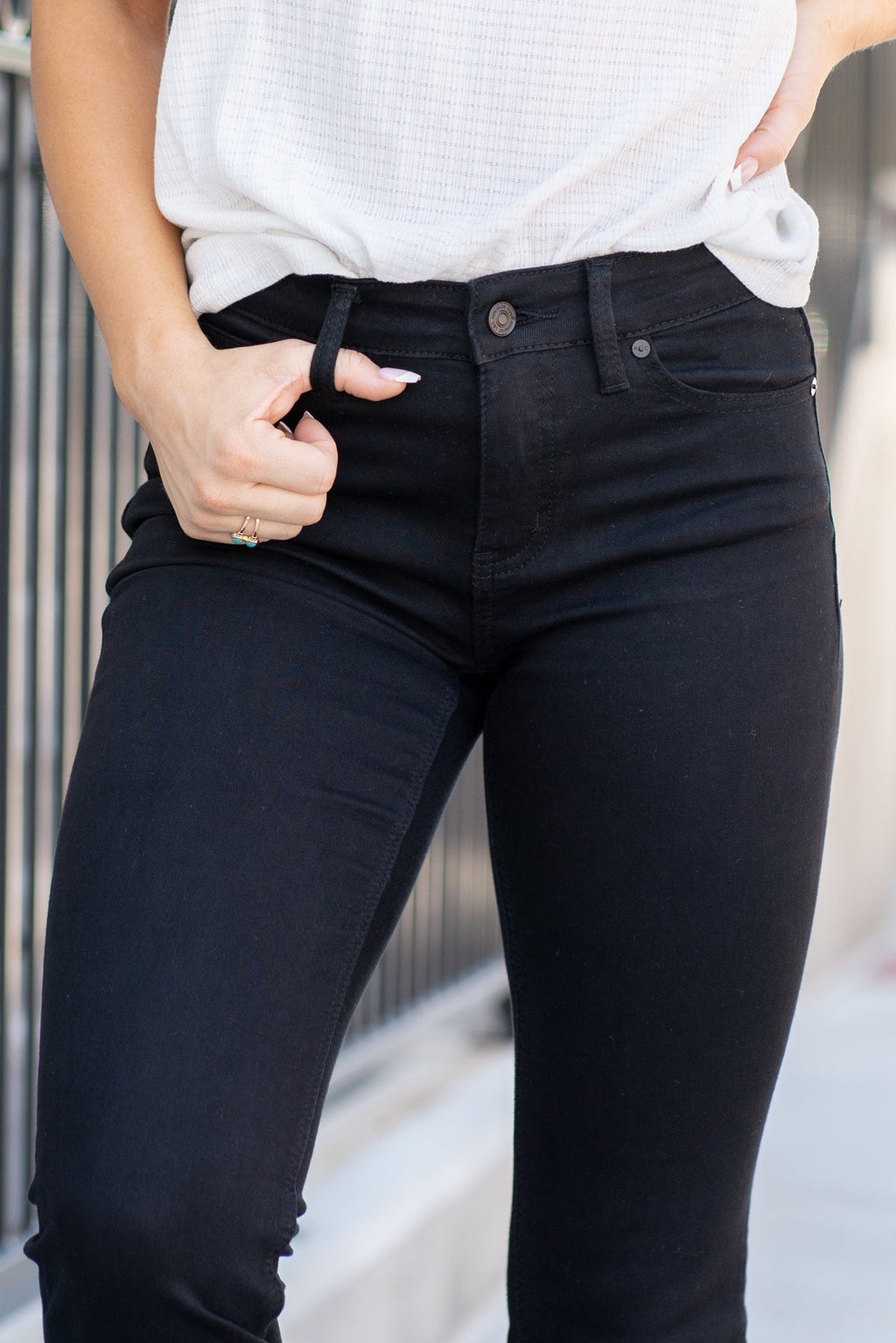 KanCan Jeans Collection: Core Style  Color: Black Cut: Flare, 33.75" Inseam* Rise: Mid-Rise, 9" Front Rise* Material: 65% COTTON , 33% RAYON , 2% SPANDEX Fly: Zipper  Style #: KC6102BK *Measured on the smallest size, measurements may vary by size.  Contact us for any additional measurements or sizing.