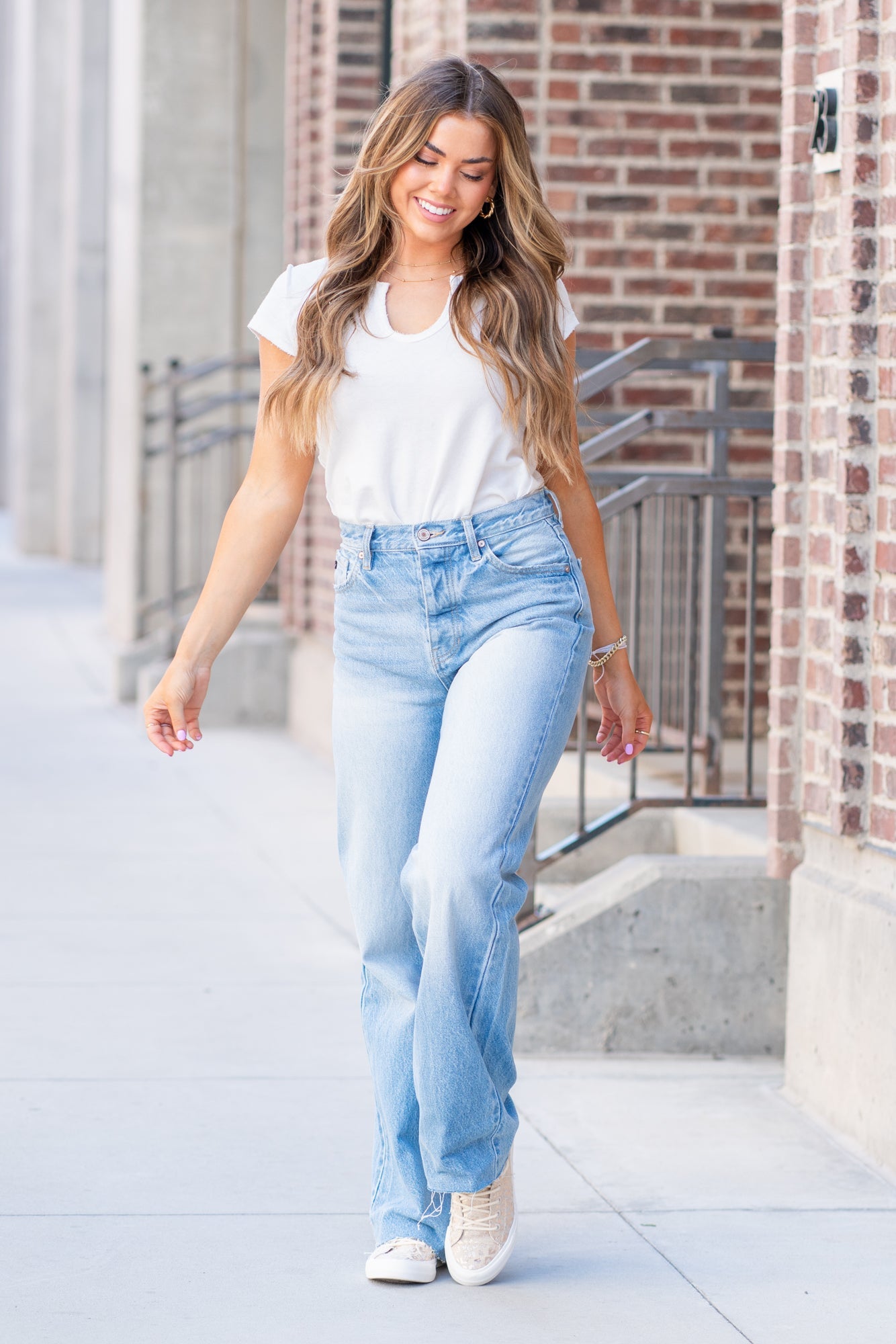 KanCan Jeans  KanCan Rigid Denim  Flare, 32" Inseam  High Rise, 12" Front Rise Light Blue Wash  100% Cotton Fly: Exposed Button Style #: KC8725L Contact us for any additional measurements or sizing.  *Measured on the smallest size, measurements may vary by size.  Jacquelyn wears a size 25 in jeans, a small in tops, and 6.5 in shoes. She is wearing a size 25 in these jeans.