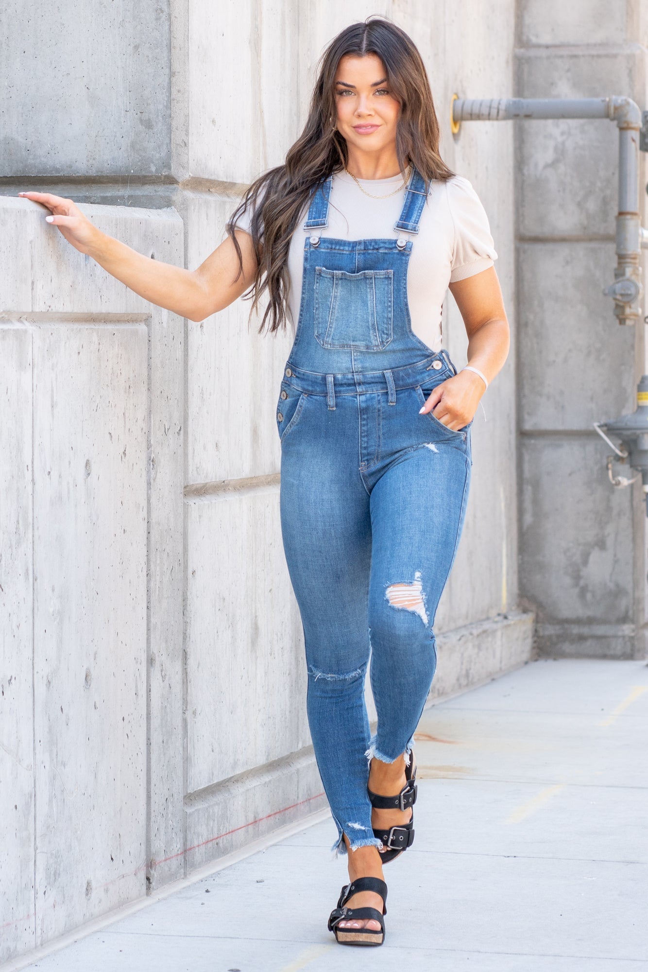 KanCan Jeans  98% Cotton 2% Spandex Medium Blue Cut: Skinny, 26.5" Inseam* Rise: High Rise, 10.25" Front Rise* Stitching: Classic Style #: KC7874M  Contact us for any additional measurements or sizing.  *Measured on the smallest size, measurements may vary by size.  Jacquelyn wears a size 25 in jeans, a small in tops, and 6.5 in shoes. She is wearing a size small in these overalls.