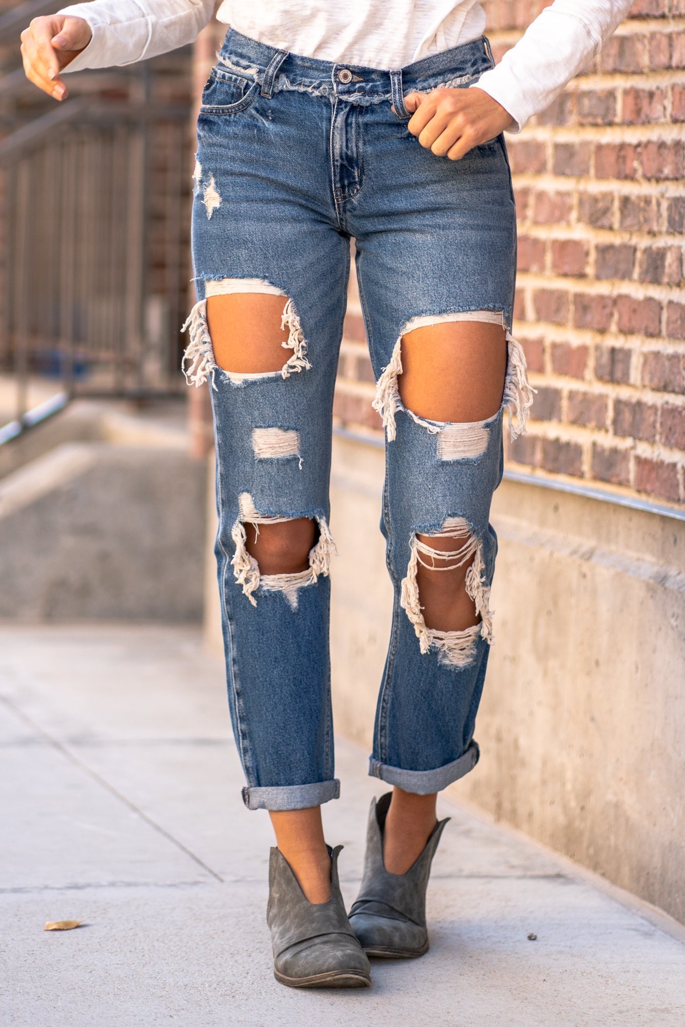 KanCan Jeans  These mid-rise boyfriend jeans hit at exactly the right spot on your waist. With 100% cotton and no stretch, these will mold to your body as you wear   KanCan Stretch Level: Comfort Stretch   Color: Medium Blue Wash Cut: Boyfriend, 27" Inseam Rise: Mid-Rise, 9" Front Rise 100% Cotton Stitching: Classic  Fly: Zipper Style #: KC70010M Contact us for any additional measurements or sizing. 