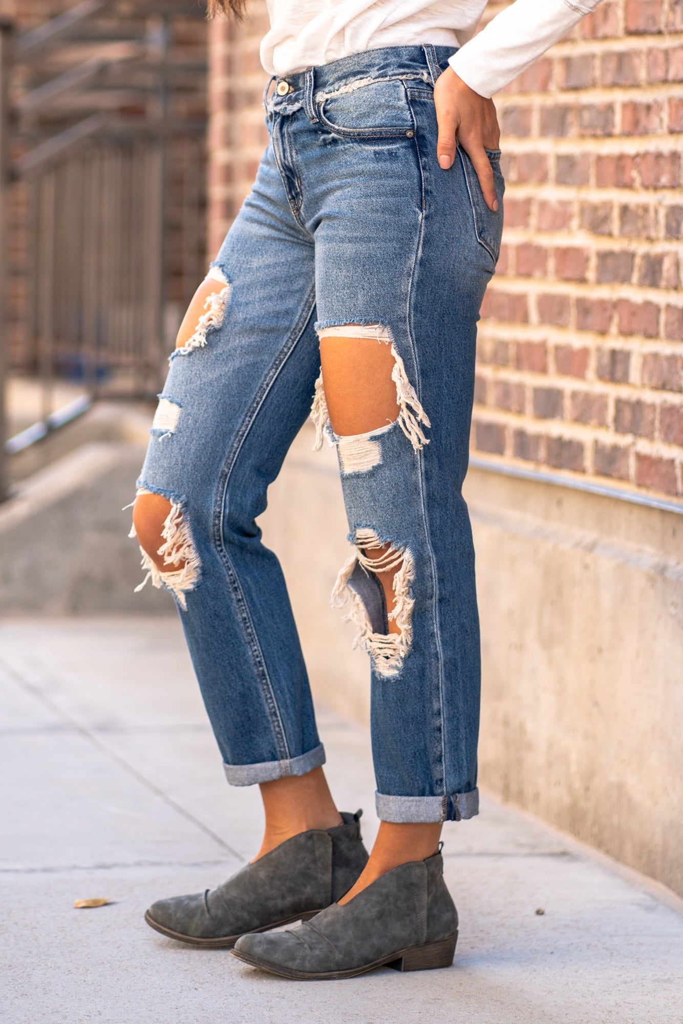 KanCan Jeans  These mid-rise boyfriend jeans hit at exactly the right spot on your waist. With 100% cotton and no stretch, these will mold to your body as you wear   KanCan Stretch Level: Comfort Stretch   Color: Medium Blue Wash Cut: Boyfriend, 27" Inseam Rise: Mid-Rise, 9" Front Rise 100% Cotton Stitching: Classic  Fly: Zipper Style #: KC70010M Contact us for any additional measurements or sizing. 
