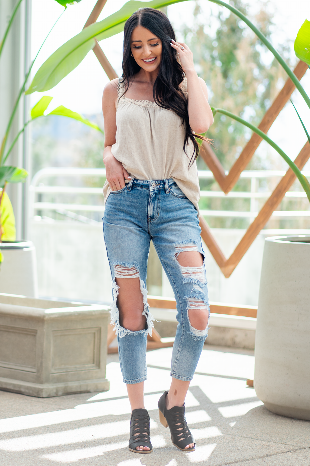 KanCan Jeans  These boyfriend jeans will become your new favorite look. Pair with a  tank and heels for a casual spring look. Color: Medium Blue Wash Cut: Straight Fit, 27" Inseam* Rise: Mid-Rise, 9.75" Front Rise* 94% COTTON, 5% POLYESTER, 1% SPANDEX Fly: Exposed Button Fly Style #: KC8571M Contact us for any additional measurements or sizing.  *Measured on the smallest size, measurements may vary by size.