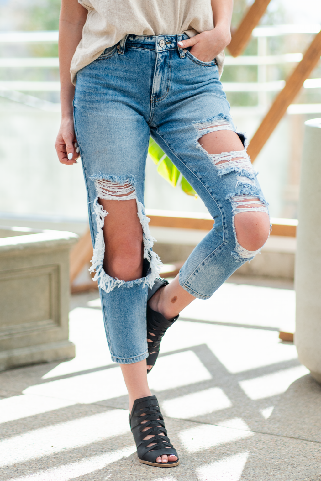 KanCan Jeans  These boyfriend jeans will become your new favorite look. Pair with a  tank and heels for a casual spring look. Color: Medium Blue Wash Cut: Straight Fit, 27" Inseam* Rise: Mid-Rise, 9.75" Front Rise* 94% COTTON, 5% POLYESTER, 1% SPANDEX Fly: Exposed Button Fly Style #: KC8571M Contact us for any additional measurements or sizing.  *Measured on the smallest size, measurements may vary by size.