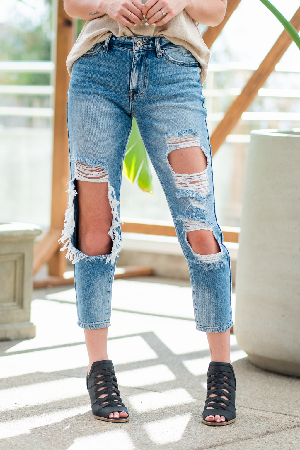 KanCan Jeans  These boyfriend jeans will become your new favorite look. Pair with a  tank and heels for a casual spring look. Color: Medium Blue Wash Cut: Straight Fit, 27" Inseam* Rise: Mid-Rise, 9.75" Front Rise* 94% COTTON, 5% POLYESTER, 1% SPANDEX Fly: Exposed Button Fly Style #: KC8571M Contact us for any additional measurements or sizing.  *Measured on the smallest size, measurements may vary by size.