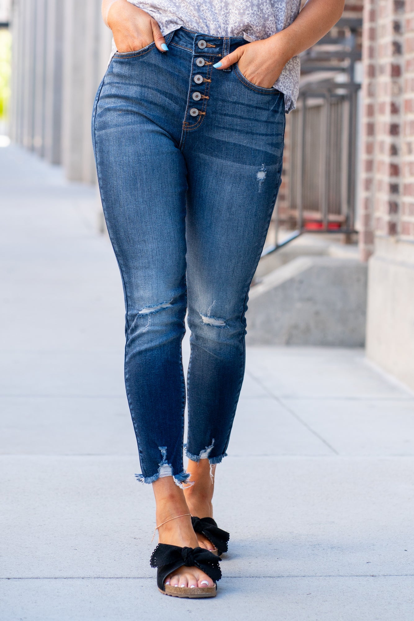 KanCan Jeans  Collection: Core Style Style Name: Geneva Color: Dark Wash Cut: Ankle Skinny, 27" Inseam* Rise: High-Rise, 11" Front Rise* 73% Cotton 14% Rayon 11% Polyester 2% Lycra Fly: Exposed Button Fly  Style #: KC8423D Contact us for any additional measurements or sizing.  *Measured on the smallest size, measurements may vary by si