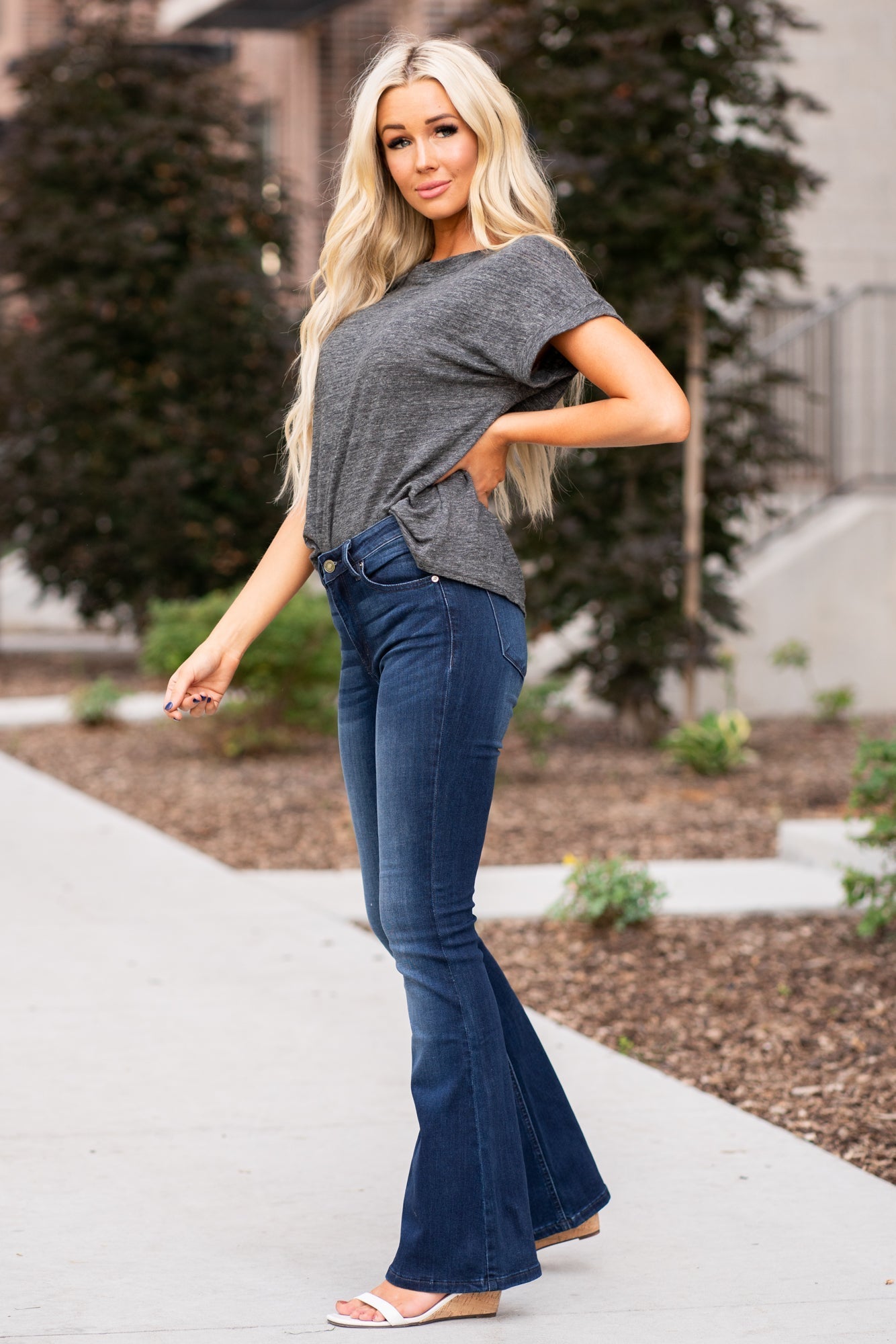 KanCan Jeans Collection: Core Style  Color: Dark Wash Cut: Flare, 31.5" Inseam  Rise: Mid-Rise, 9" Front Rise 54% COTTON 34% Rayon 10% POLYESTER 2% SPANDEX Fly: Zipper Style #: KC6102D-PT Contact us for any additional measurements or sizing.  Haley wears a size small top, a 1 in jeans and a small in tops. She is wearing a size 24/1 in these jeans.