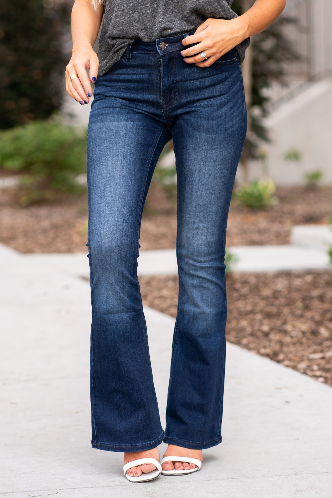 KanCan Jeans Collection: Core Style  Color: Dark Wash Cut: Flare, 31.5" Inseam  Rise: Mid-Rise, 9" Front Rise 54% COTTON 34% Rayon 10% POLYESTER 2% SPANDEX Fly: Zipper Style #: KC6102D-PT Contact us for any additional measurements or sizing.  Haley wears a size small top, a 1 in jeans and a small in tops. She is wearing a size 24/1 in these jeans.