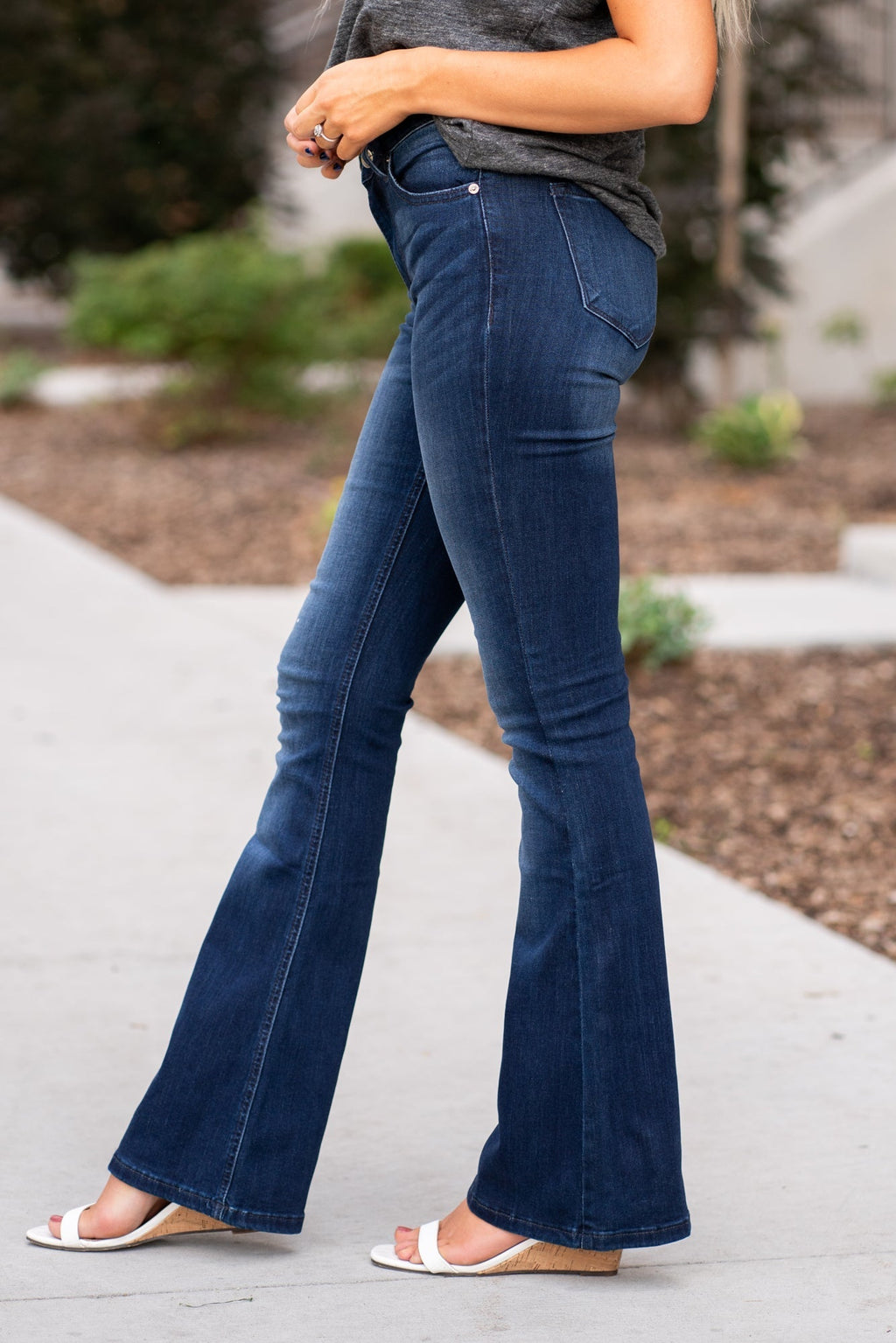 KanCan Jeans Collection: Core Style  Color: Dark Wash Cut: Flare, 31.5" Inseam  Rise: Mid-Rise, 9" Front Rise 54% COTTON 34% Rayon 10% POLYESTER 2% SPANDEX Fly: Zipper Style #: KC6102D-PT Contact us for any additional measurements or sizing.  Haley wears a size small top, a 1 in jeans and a small in tops. She is wearing a size 24/1 in these jeans.