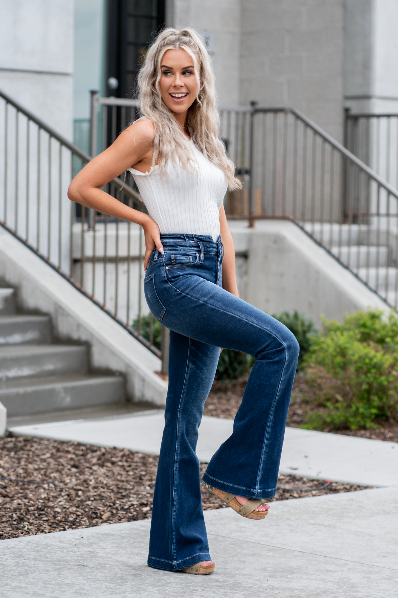 KanCan Jeans   KanCan Stretch Level: Comfort Stretch  Curvy Fit Flare   Color: Dark Blue Wash Cut: Flare, 33" Inseam  Rise: High Rise, 11" Front Rise 95% COTTON, 4% POLYESTER, 1% LYCRA Fly: Exposed Button Fly Style #: KC8602D-CV Contact us for any additional measurements or sizing.  *Measured on the smallest size, measurements may vary by size. 