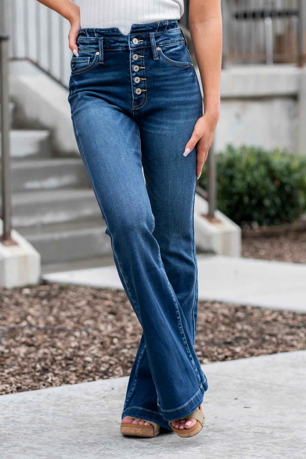 KanCan Jeans   KanCan Stretch Level: Comfort Stretch  Curvy Fit Flare   Color: Dark Blue Wash Cut: Flare, 33" Inseam  Rise: High Rise, 11" Front Rise 95% COTTON, 4% POLYESTER, 1% LYCRA Fly: Exposed Button Fly Style #: KC8602D-CV Contact us for any additional measurements or sizing.  *Measured on the smallest size, measurements may vary by size. 