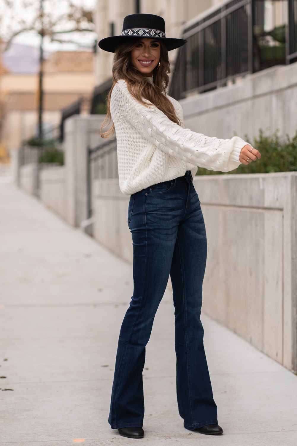 KanCan Jeans Collection: Core Style  Color: Dark Wash Cut: Flare, 33.75" Inseam  Rise: Mid-Rise, 9" Front Rise 54% 54% COTTON 34% Rayon 10% POLYESTER 2% SPANDEX Fly: Zipper Style #: KC6102D Contact us for any additional measurements or sizing.  Taylor is 5'7" and wears a size 4 in jeans, small top and an 8.5 in shoes. She is wearing a size size 25/3 in these jeans.