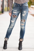 KanCan Jeans  Collection: Core Style Style Name: Mason Leopard Patch Skinny Color: Medium Dark Wash Cut: Skinny, 29.5" Inseam Rise: Mid-Rise, 8.5" Front Rise 70% COTTON 19% POLYESTER 10% RAYON 1% LYCRA Fly: Zipper  Style #: KC8191D Contact us for any additional measurements or sizing.  Melissa is 5'5" and wears a 2 in jeans, small top and size 6 shoe. She is wearing a 24/1 in these jeans.